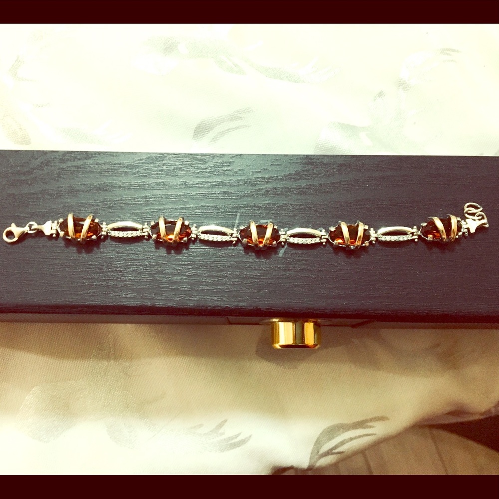 Silver, gold accents, yellow gem, zirconia